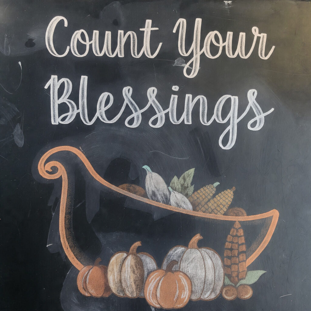a chalkboard with a simple cornucopia overflowing