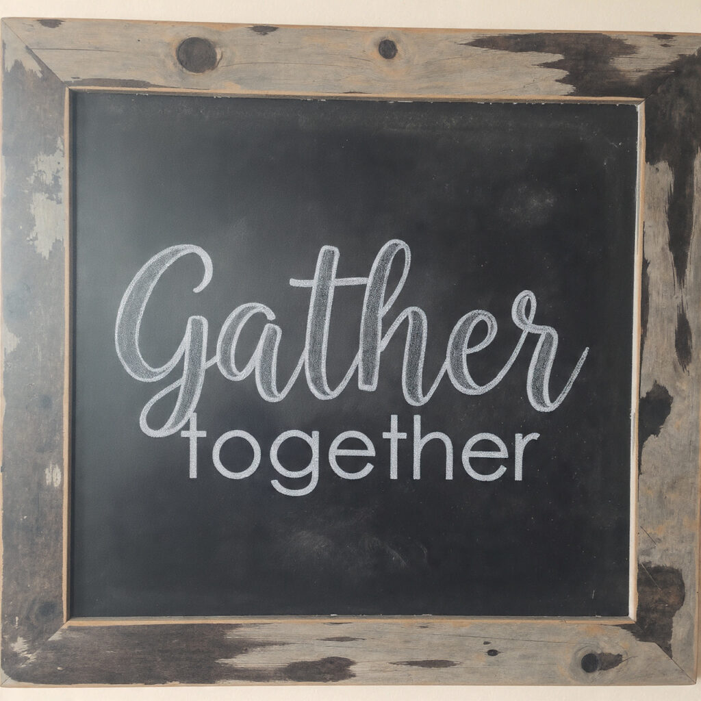 a farmhouse style thanksgiving chalkboard with the word