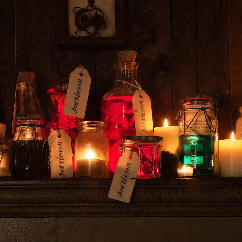 a mantel with glass bottles and jars
