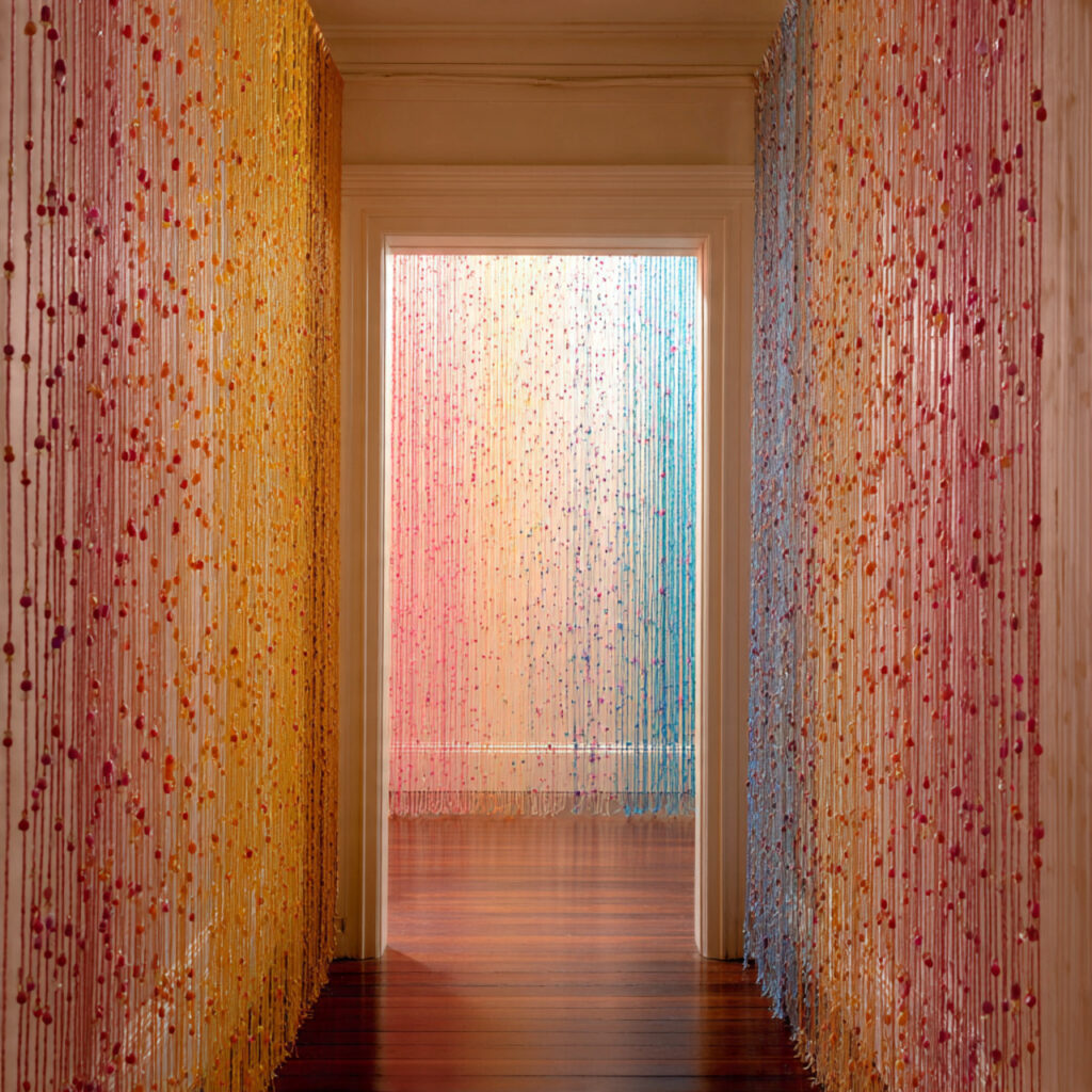 String a Curtain of Beads or Ribbons as a Room Divider