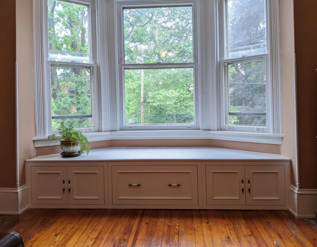 29 Cozy Reading Nook Ideas That Turn Any Corner Into a Relaxing Escape You'll Never Want to Leave 3 A Window Seat With Cushions