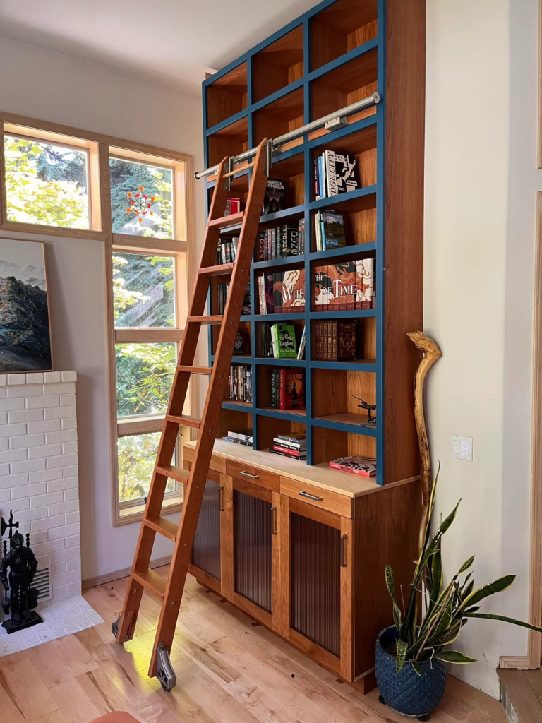 29 Cozy Reading Nook Ideas That Turn Any Corner Into a Relaxing Escape You'll Never Want to Leave 15 A Ladder Shelf Beside the Chair