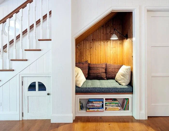 29 Cozy Reading Nook Ideas That Turn Any Corner Into a Relaxing Escape You'll Never Want to Leave 27 The Under-Stair Reading Nook