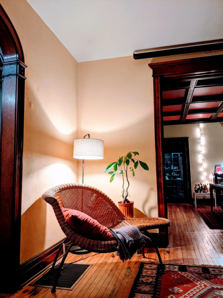 26 Apartment Reading Nook Ideas That Make Small Spaces Feel Warm, Stylish, and Super Cozy 6 A Rattan Chair for Natural Warmth