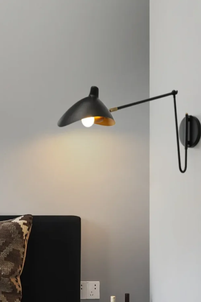 26 Apartment Reading Nook Ideas That Make Small Spaces Feel Warm, Stylish, and Super Cozy 8 A Plug-In Swing-Arm Wall Lamp