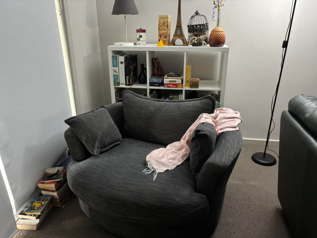 26 Apartment Reading Nook Ideas That Make Small Spaces Feel Warm, Stylish, and Super Cozy 15 A Small Bookcase as the Nook's Back Wall