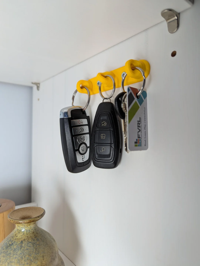 21 Tiny Entryway Storage Ideas That Make Small Spaces Look Stylish and Functional 6 A Magnetic Key Rack Mounted by the Door