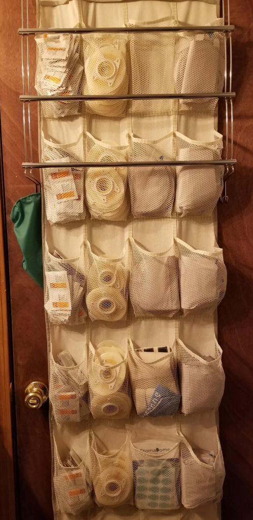 21 Tiny Entryway Storage Ideas That Make Small Spaces Look Stylish and Functional 12 An Over-Door Organizer With Multiple Pockets